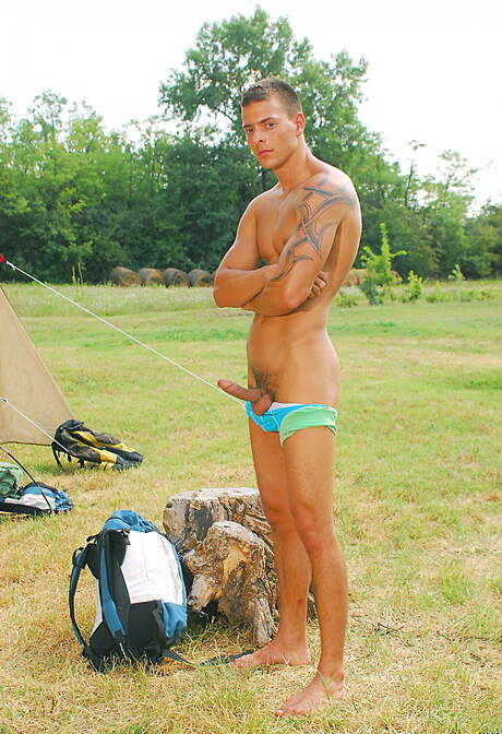 Hungarian superstud Joey Visconti undressing and showing his butt outside