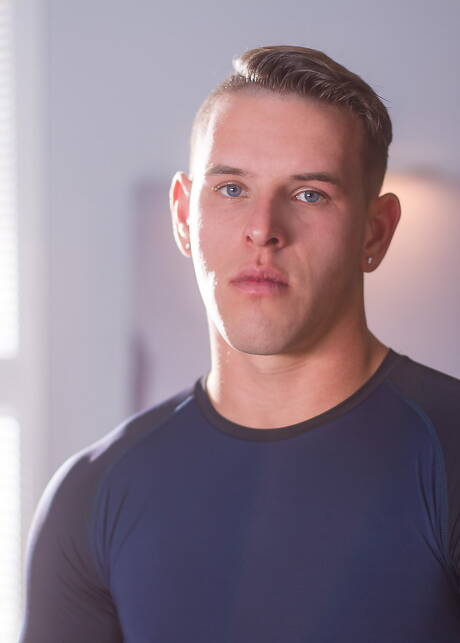 American bodybuilder Shane Cook posing naked outside