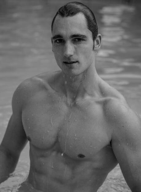 American beefcake Luke Wilder shows a muscle body at the pool