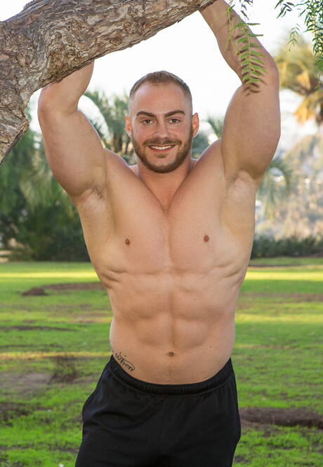 Muscular Jayden and muscular Brock love each other outdoor