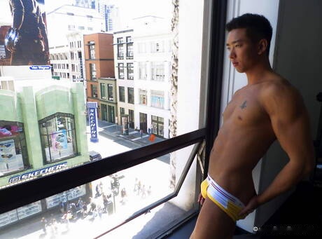 Asian hunk Tristan Tran undressing and showing nice butt