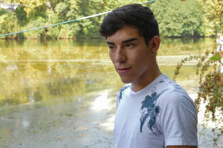 Latin twink Roman Capellini undressing and showing his ass outdoor